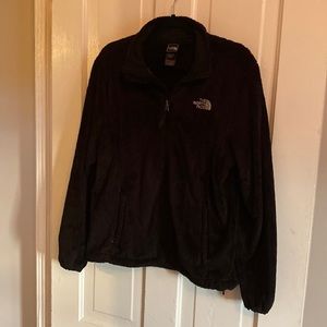 Large black North Face fuzzy jacket.